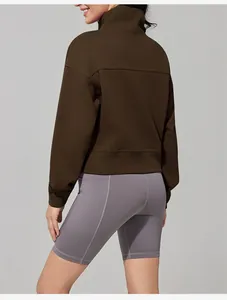 Back view of women's brown mock neck sweatshirt with loose fit for outdoor sports