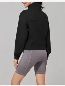 Back view of women's black stand-up collar sports sweatshirt and grey yoga shorts.