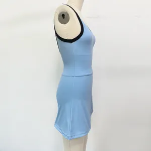 Light blue U-back tennis dress with black contrast trim on mannequin for sports