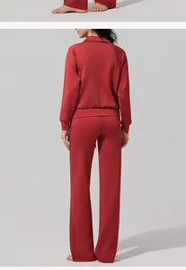 Rear view of women's red air layer sports set featuring half-zip top and wide pants