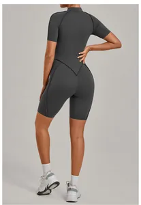 Back view of a sleek dark grey one-piece yoga jumpsuit for high-intensity fitness.