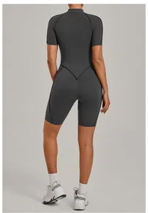 Back view of a grey women's high-performance yoga jumpsuit with a professional fit.