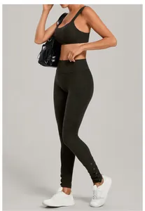 Charcoal grey yoga set with adjustable sports bra and button-detail leggings for fitness