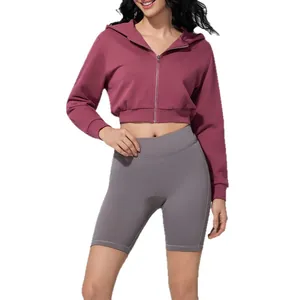 Stylish women's cropped maroon zip-up hoodie with hood and grey high-waisted gym shorts set