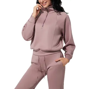 Women's mauve half-zip athletic tracksuit set in soft air layer fabric for yoga.