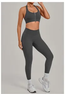 Full view of women's dark grey yoga set featuring a front zipper sports bra