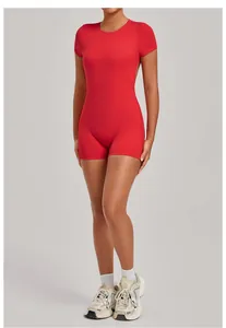Detail shot of red backless yoga bodysuit showcasing slim fit and athletic style.