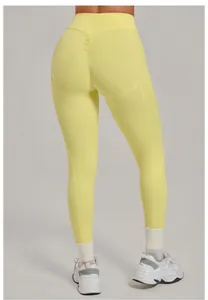 Vista posteriore di leggings yoga gialli a vita alta con arricciatura push-up