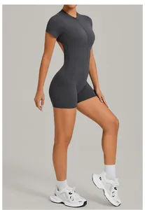 Detailed view of dark gray athletic bodysuit with open back and half-zip.