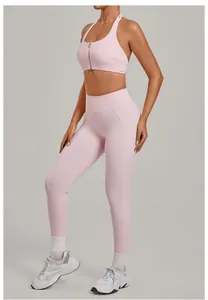 Full view of light pink two-piece yoga set featuring zip-front sports bra and leggings