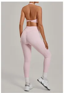 Back view of pink high-waisted scrunch butt yoga leggings and halter top gym set for women