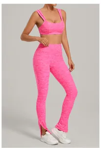 Detail view of hot pink brushed yoga set featuring adjustable straps and flared split leggings.