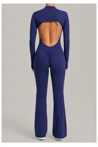 Back view of a navy blue long-sleeve flared yoga jumpsuit featuring a stylish cut-out back detail.
