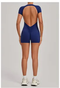 Detailed back view of a navy blue backless yoga romper featuring scrunch butt lifting design