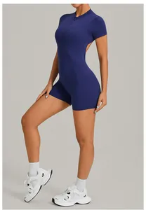Close-up of a backless navy blue sports bodysuit with half-zip detail for yoga and fitness
