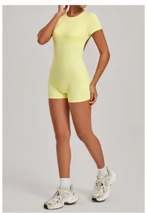 Detailed view of women's yellow backless yoga bodysuit for athletic fitness training.