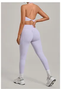 Back view of a woman wearing a purple high-waist yoga set with scrunch butt leggings