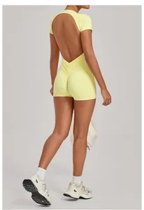 Back view of a yellow backless yoga bodysuit with scrunch butt detail and short sleeves