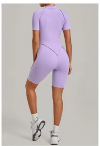 Back view of a sleek purple one-piece yoga jumpsuit showing athletic fit and seam details