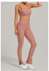 Detail view of a dusty pink brushed yoga set with high waist leggings and slit hem.