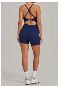 Rear view of deep blue yoga romper featuring criss-cross back straps and cutout design
