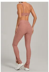 Back view of brushed yoga set featuring adjustable straps and snap button split hem leggings