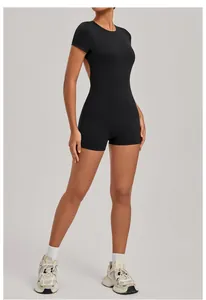 Close-up detail of a backless black athletic one-piece bodysuit for yoga and fitness