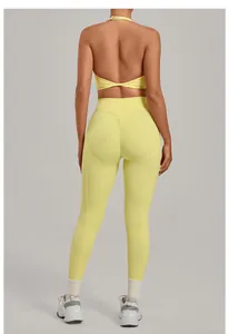 Back view of high-waist yellow yoga leggings and halter top showing hip-lifting design