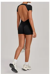 Detail view showing backless design and ruched booty of this black yoga bodysuit