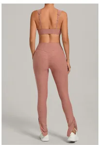 Back view of mauve yoga set featuring adjustable bra straps and buttoned split hem leggings