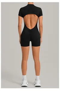 Close-up detail of a black backless athletic yoga romper with a flattering scrunch butt design