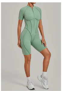Detail of women's half-zip yoga bodysuit in sage green for high-intensity fitness.
