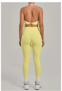 Back view of yellow high-waist scrunch butt yoga leggings and halter sports bra set