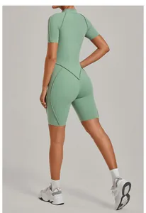 Detailed back view of a sage green short-sleeve one-piece yoga jumpsuit with V-line seams