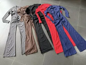 Long sleeve flared yoga jumpsuit unitard with back cutout detail in multiple colors
