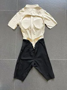 Close-up of cutout back design on two-tone fitness jumpsuit with built-in pads