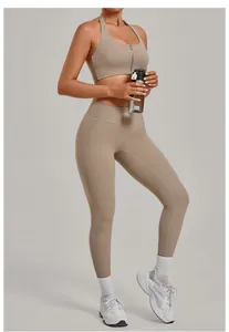 Close-up of beige yoga set with front zipper sports bra and high-waisted leggings.