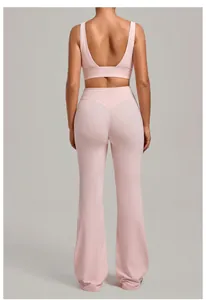 Back view of pink yoga set featuring a U-neck sports bra and high-waisted flare pants