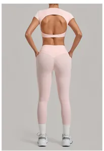 Back view of pink yoga set including back cutout crop top and high-waisted leggings