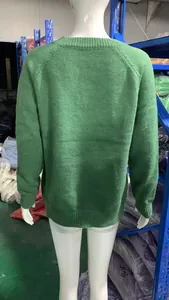 Back view of a classic green crewneck knit sweater for women, showing texture and fit