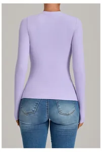 Back view of a tight lavender long-sleeve yoga top for fitness and pilates training.