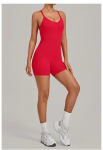 Detail view of a vibrant red one-piece yoga romper with a flattering V-neckline design.