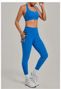Full body view of women's blue yoga set featuring a zipper sports bra and pocket leggings