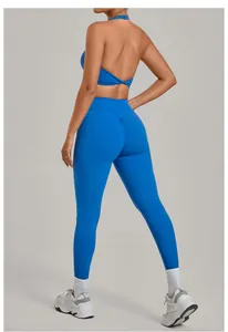 Back view of a blue scrunch butt yoga set with a halter top and high-waisted leggings.