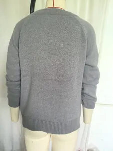 Back view detail of a classic grey round neck long sleeve knit sweater on a mannequin