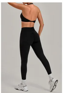 Rear view of black high-waisted scrunch butt yoga leggings and sports bra set