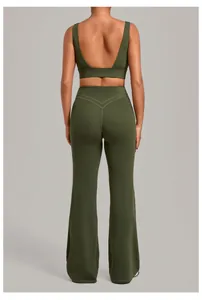 Back view detail of olive green sports bra and high-waisted flared leggings yoga set