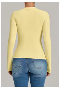 Back view of slim fit yellow long sleeve yoga top for high-impact fitness training