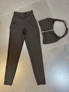 Detail of black nude-feel yoga set with zipper sports bra and high-waisted leggings