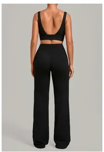 Detail back view of black backless yoga sports bra and high waist flared pants set